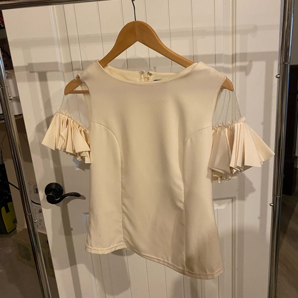 Cream colored blouse with scrap sleeves